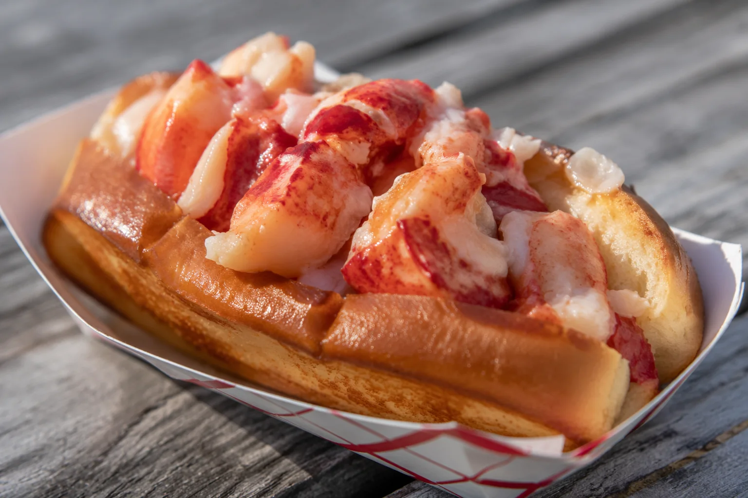 AI-generated concept of a lobster roll in a toasted brioche bun, served in a paper boat on a weathered table.